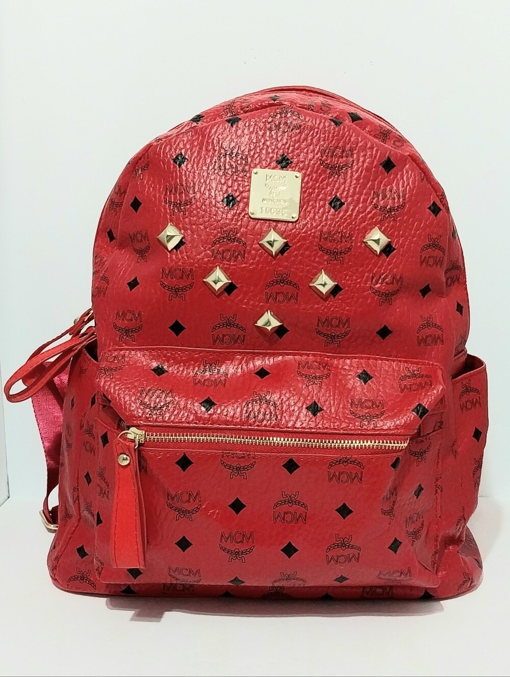 MCM Red Studded Monogram Backpack with Gold Accents